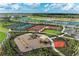 Aerial view showcasing the community playground and sports courts, creating a vibrant and active lifestyle at 4324 Dairy Ct, Lakewood Ranch, FL 34211