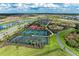 Aerial view of newly built tennis and playground courts in new community at 4324 Dairy Ct, Lakewood Ranch, FL 34211