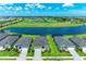 Beautiful aerial view of homes surrounding a scenic lake in a vibrant community at 4324 Dairy Ct, Lakewood Ranch, FL 34211