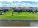 Backyard with a covered patio overlooking a scenic lake at 4324 Dairy Ct, Lakewood Ranch, FL 34211
