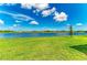 Lush green backyard extending to a beautiful lake, perfect for relaxation at 4324 Dairy Ct, Lakewood Ranch, FL 34211