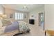 Serene bedroom featuring soft lighting, plantation shutters, and a view to the ensuite bathroom at 4324 Dairy Ct, Lakewood Ranch, FL 34211