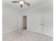 Neutral bedroom offers a closet, carpeted floors, and door to another room at 4324 Dairy Ct, Lakewood Ranch, FL 34211