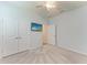 Spacious bedroom with carpet, closet, and television mounted on the wall at 4324 Dairy Ct, Lakewood Ranch, FL 34211