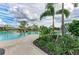 Stunning community pool featuring tropical landscaping, lounge chairs, and shaded areas, perfect for relaxation and recreation at 4324 Dairy Ct, Lakewood Ranch, FL 34211