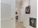 Hallway with hardwood floors, stylish lighting, and open doorways to other rooms at 4324 Dairy Ct, Lakewood Ranch, FL 34211