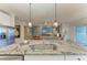 View of living area and water from kitchen with granite counter and stainless appliances at 4324 Dairy Ct, Lakewood Ranch, FL 34211