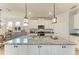 Modern kitchen with stainless appliances, granite counters, and pendant lighting at 4324 Dairy Ct, Lakewood Ranch, FL 34211