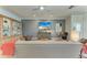 Inviting living room featuring hardwood floors, comfortable furnishings, and ample natural light at 4324 Dairy Ct, Lakewood Ranch, FL 34211