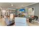 Comfortable living room with ceiling fan, television, and stylish decor at 4324 Dairy Ct, Lakewood Ranch, FL 34211
