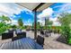 Outdoor patio area featuring comfortable seating and lush landscaping at 4324 Dairy Ct, Lakewood Ranch, FL 34211
