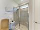 Modern tiled shower with glass enclosure, offering a clean and stylish design at 4324 Dairy Ct, Lakewood Ranch, FL 34211