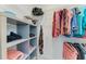 Efficient walk-in closet with shelves and hanging space, providing organized storage solutions at 4324 Dairy Ct, Lakewood Ranch, FL 34211
