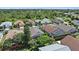 Neighborhood aerial view showcasing lush greenery and diverse home styles at 4330 Beekman Pl # 103, Sarasota, FL 34235