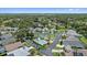 Aerial view of a community pool with tennis courts and well-maintained landscaping at 4330 Beekman Pl # 103, Sarasota, FL 34235