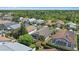 Aerial view of homes in a quiet neighborhood with mature trees at 4330 Beekman Pl # 103, Sarasota, FL 34235