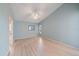 Light-filled bedroom with light blue walls and light wood floors at 4330 Beekman Pl # 103, Sarasota, FL 34235