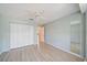 This light and airy bedroom offers tile floors, a ceiling fan, and a large closet at 4330 Beekman Pl # 103, Sarasota, FL 34235