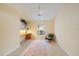 This sunny bedroom has tile floors, a ceiling fan, and built-in shelving at 4330 Beekman Pl # 103, Sarasota, FL 34235