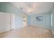 Bright blue bedroom with closet and connected bathroom at 4330 Beekman Pl # 103, Sarasota, FL 34235