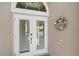 An inviting set of double doors features a welcome wreath at 4330 Beekman Pl # 103, Sarasota, FL 34235