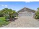 The spacious garage and brick-paved driveway add to the home's curb appeal at 4330 Beekman Pl # 103, Sarasota, FL 34235