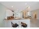 Kitchen featuring granite countertops, stainless steel appliances, and an eat-in breakfast bar at 4330 Beekman Pl # 103, Sarasota, FL 34235