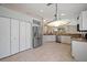 Kitchen with granite counters, stainless appliances, pantry, and view to the backyard window at 4330 Beekman Pl # 103, Sarasota, FL 34235