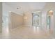 Bright living room with vaulted ceilings and tile floors at 4330 Beekman Pl # 103, Sarasota, FL 34235
