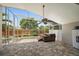 This screened-in lanai features a spa, pavers, and lots of room for relaxing at 4330 Beekman Pl # 103, Sarasota, FL 34235