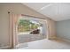 The screened-in sunroom offers tile floors and sliding glass doors at 4330 Beekman Pl # 103, Sarasota, FL 34235