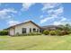 Lush backyard with well-kept lawn, mature landscaping, and screened-in lanai perfect for relaxing outdoors at 4330 Presidential Avenue E Cir, Bradenton, FL 34203