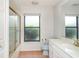 Clean bathroom offers a shower with gold trim and a large window at 4330 Presidential Avenue E Cir, Bradenton, FL 34203