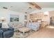 Open-concept living room with a fireplace, comfortable seating, and tile flooring, perfect for entertaining guests at 4330 Presidential Avenue E Cir, Bradenton, FL 34203