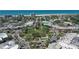 Aerial view of a quaint coastal town center with palm trees and shops near the beach at 444 S Polk Dr, Sarasota, FL 34236