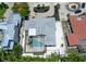 Expansive aerial view of a single Gathering home with a pool and a screened-in lanai at 444 S Polk Dr, Sarasota, FL 34236