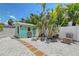 Private backyard retreat with a charming shed and mature tropical landscaping at 444 S Polk Dr, Sarasota, FL 34236