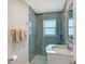 Updated bathroom with a glass shower, brushed nickel fixtures, and mosaic tile accents at 444 S Polk Dr, Sarasota, FL 34236