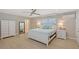 Spacious bedroom with a ceiling fan, natural light, and light-colored furniture at 444 S Polk Dr, Sarasota, FL 34236