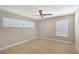 Bedroom with neutral paint, light wood flooring and shuttered windows at 444 S Polk Dr, Sarasota, FL 34236