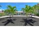 Charming home with a well-manicured front yard and beautiful palm trees for added curb appeal at 444 S Polk Dr, Sarasota, FL 34236