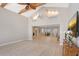 Bright living room with views to dining area, fireplace, and pool at 444 S Polk Dr, Sarasota, FL 34236