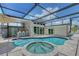 Relaxing pool and spa with screened lanai offering a private outdoor oasis at 444 S Polk Dr, Sarasota, FL 34236