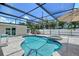 Sparkling pool and spa surrounded by a screened enclosure for year-round enjoyment at 444 S Polk Dr, Sarasota, FL 34236