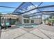 Private pool and spa area with a screened enclosure and sunny lounging area at 444 S Polk Dr, Sarasota, FL 34236