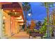 Charming street view with lit storefronts and inviting sidewalks lined with greenery at 444 S Polk Dr, Sarasota, FL 34236