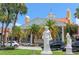 Elegant building with palm trees and statues, creating a luxurious streetscape at 444 S Polk Dr, Sarasota, FL 34236