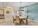 Formal dining room featuring a modern chandelier and large windows, perfect for entertaining at 4714 Seneca Park Trl, Bradenton, FL 34211