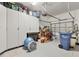 Spacious garage with storage cabinets, workbench, and ample room for parking and projects at 4714 Seneca Park Trl, Bradenton, FL 34211