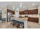 Modern kitchen featuring granite countertops, stainless steel appliances, and an island with seating at 4714 Seneca Park Trl, Bradenton, FL 34211